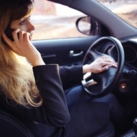 Lady on a cell phone while driving Lady on a cell phone while driving