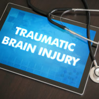 Ipad that reads Traumatic brain injury