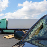 The car hits a big rig The car hits a big rig