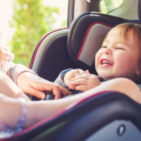 Toddler girl in her car seat