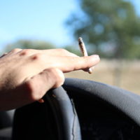 guy smoking while driving guy smoking while driving