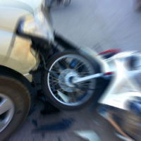 Pickup in the midst of crash with motorcycle on the road Pickup in the midst of crash with motorcycle on the road