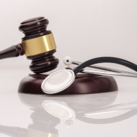 gavel on top of stethoscope to conceptualize medical malpractice gavel on top of stethoscope to conceptualize medical malpractice
