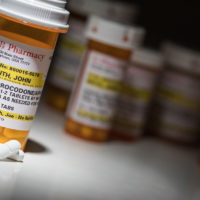 Hydrocodone Pills and Prescription Bottles with Non Proprietary Label in cupboard Hydrocodone Pills and Prescription Bottles with Non Proprietary Label in cupboard