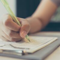 Close up hand asian woman writing on paper