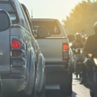 people driving car on road traffic jam with rush hour in the city