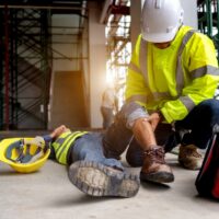 First aid support accident at work of construction worker at sit