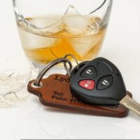 Image of a drink and car keys, representing how a West Virginia drunk driving accident attorney helps injured victims.