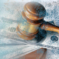 Image of a gavel and money, representing how personal injury lawyers in West Virginia help clients obtain compensation.