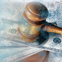 Image of a gavel and money, representing how personal injury lawyers in West Virginia help clients obtain compensation.
