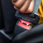 Woman Buckling Up Seatbelt