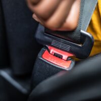 Woman Buckling Up Seatbelt Woman Buckling Up Seatbelt