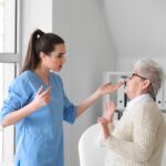Medical worker mistreating senior woman in nursing home