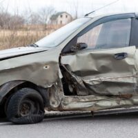 Damage to the car after a side collision with another car.