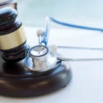 Gavel and stethoscope. medical jurisprudence. legal definition of medical malpractice. attorney. common errors doctors, nurses and hospitals make