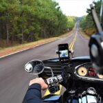 Image of a motorcyclist driving on a mountain road, representing the impacts of West Virginia motorcycle accident injuries.