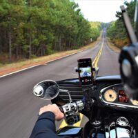 Image of a motorcyclist driving on a mountain road, representing the impacts of West Virginia motorcycle accident injuries. Image of a motorcyclist driving on a mountain road, representing the impacts of West Virginia motorcycle accident injuries.